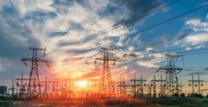 distribution electric substation with power lines and transformers. power cable towers to represent business utilities