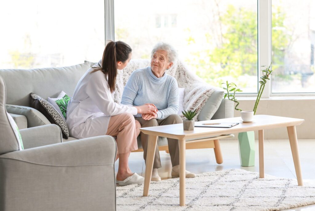 Doctor with senior woman in nursing home