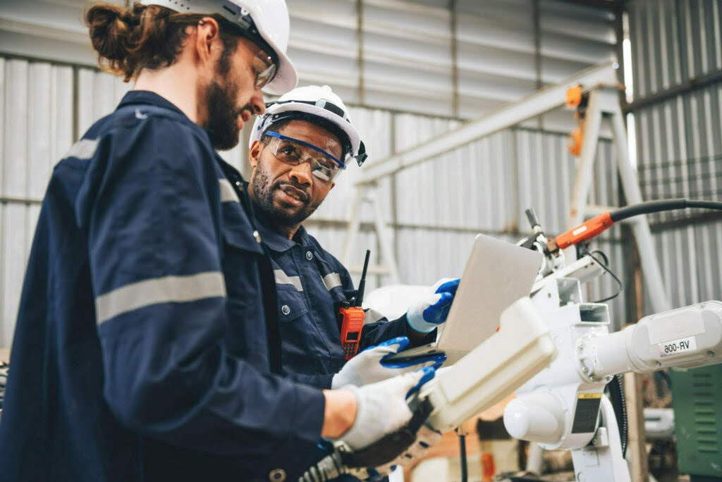 Specialist robotic engineers maintenance and control robot arm