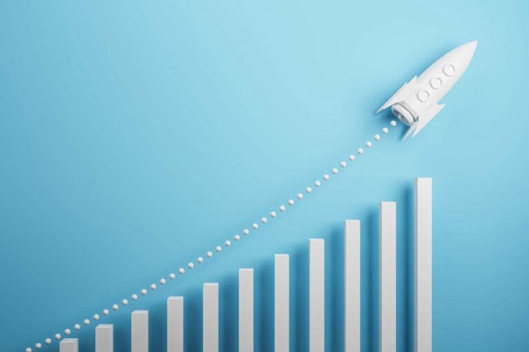 Startup and new project concept with white rocket flying up with dotted trajectory above light growth graph on blue background. 3D rendering Startup and new project concept with white rocket flying up with dotted trajectory above light growth graph on blue background. showing the rise in energy despite the energy price cap