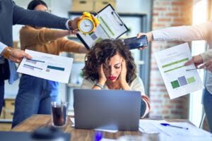 Group of business workers working together. Partners stressing one of them at the office Group of business workers working together. Partners stressing one of them at the office