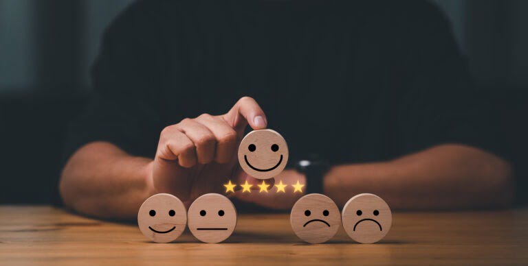 good broker customer services best excellent business rating experience. Satisfaction survey concept. Hand of a businessman chooses a smile face on wood block cube. 5 Star Satisfaction.