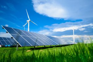 Solar energy panels and windmills against blue sky on summer day Solar energy panels and windmills against blue sky on summer day, background