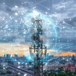 Telecom tower with 5G cellular network antenna on city background, Global connection and internet network concept