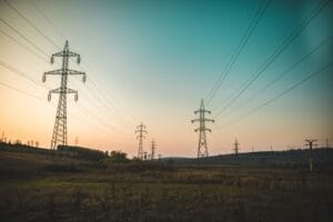 alexandru-boicu-h0z0ptvGVR8-unsplash power lines at sunset representing MHHS