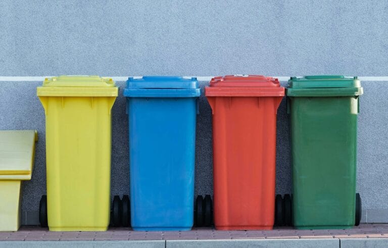 Colourful bins in a row to represent simpler recycling regulations