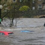 UK climate disasters represented by sinking cars