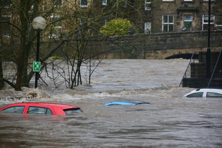 UK climate disasters represented by sinking cars