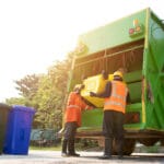 How Do I Know If I Need An Additional Bin? 6 men disposing of rubbish with multiple bins representing an additional bin