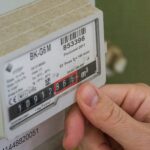 arthur-lambillotte-rP1iwkrbSe0-unsplash A close-up of a hand and an energy meter representing how we helped a customer get their new energy contract on track