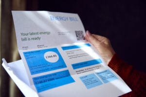 Close Up Of Senior Woman Opening UK Energy Bill Concerned About Cost Of Living Energy Crisis energy bills