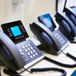 voip phones lined up in office