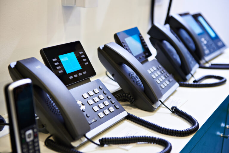 voip phones lined up in office