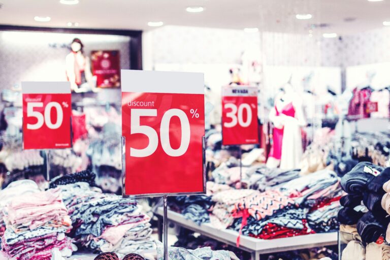 busy shop with red sale signs representing black friday